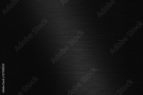 Polished black metal background. Striped abstract texture photo