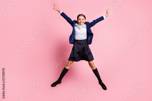 Full length body size view of her she nice attractive pretty glad cheerful cheery small little girl jumping having fun good mood rest isolated over pink pastel color background