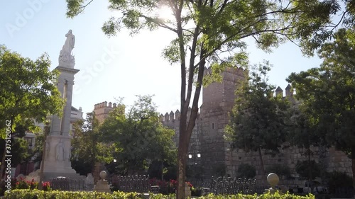 Sunflare Shining over Seville Alcazar Castle Walls in Spain, Dolly Left