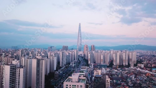 Moving cinematic drone shot of Seoul, south Korea city scape at Sunset