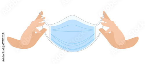 Medical mask in hands. Protective medical face mask against viruses and bacteria. hands put on mask. medical. professional medical care accessories.
