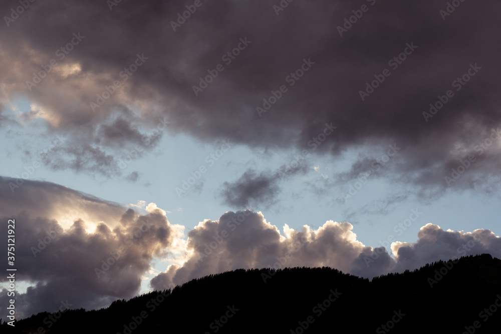 Fototapeta premium Sunset skyscape over Swiss mountains 