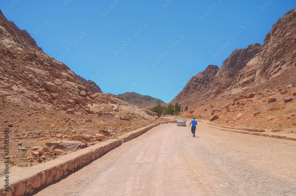 dirt road among the mountains of red sandstone