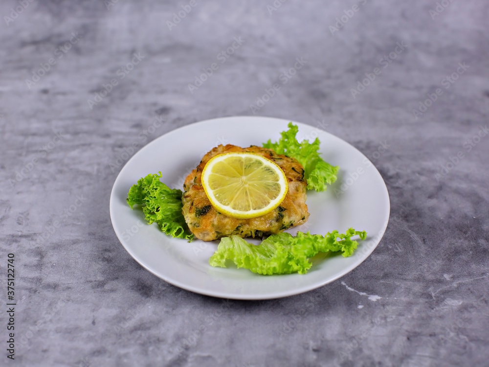 Fish with lemon on a plate