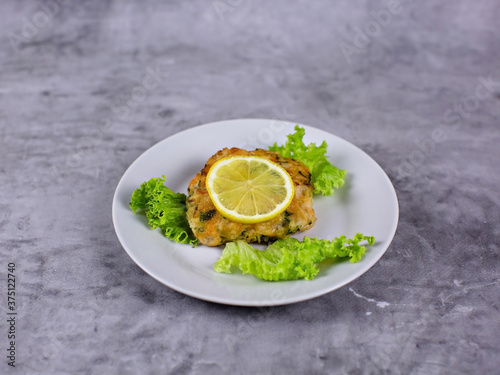 Fish with lemon on a plate