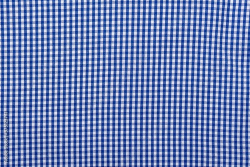 Blue checkered textile, part of checkered shirt, top view as background or texture