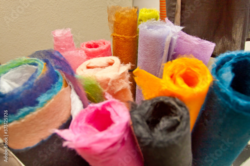 A variety of colored handmade colored-paper is on display. photo