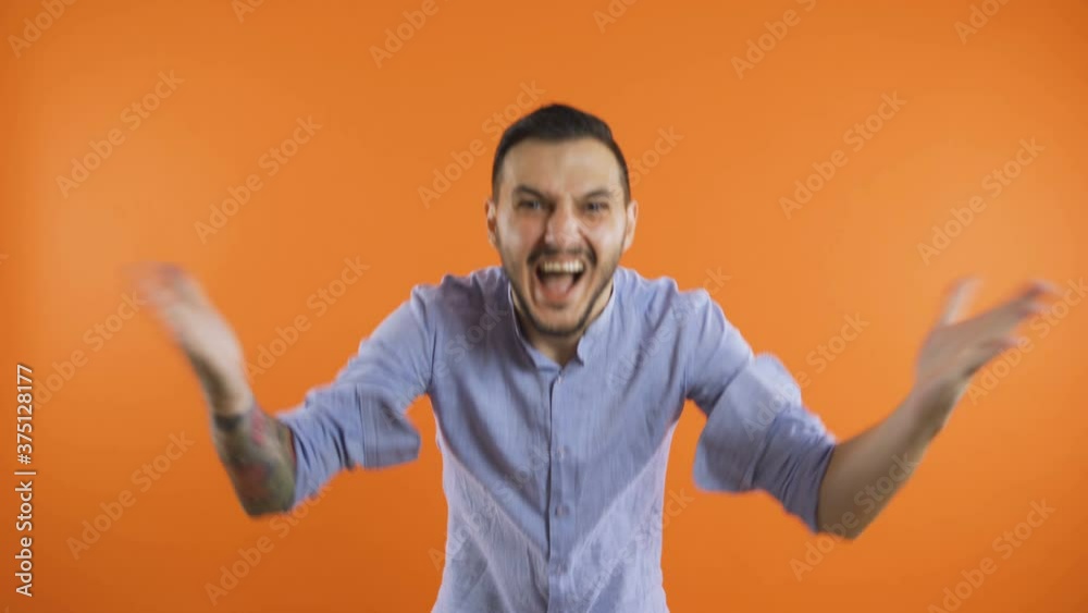 Angry man confused wondering asking how concept. Arms wide open asking how and why concept Angry man confused wondering asking how concept. Arms wide open asking how and why concept