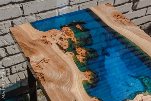 beautiful wooden table made of elm slab and epoxy resin
