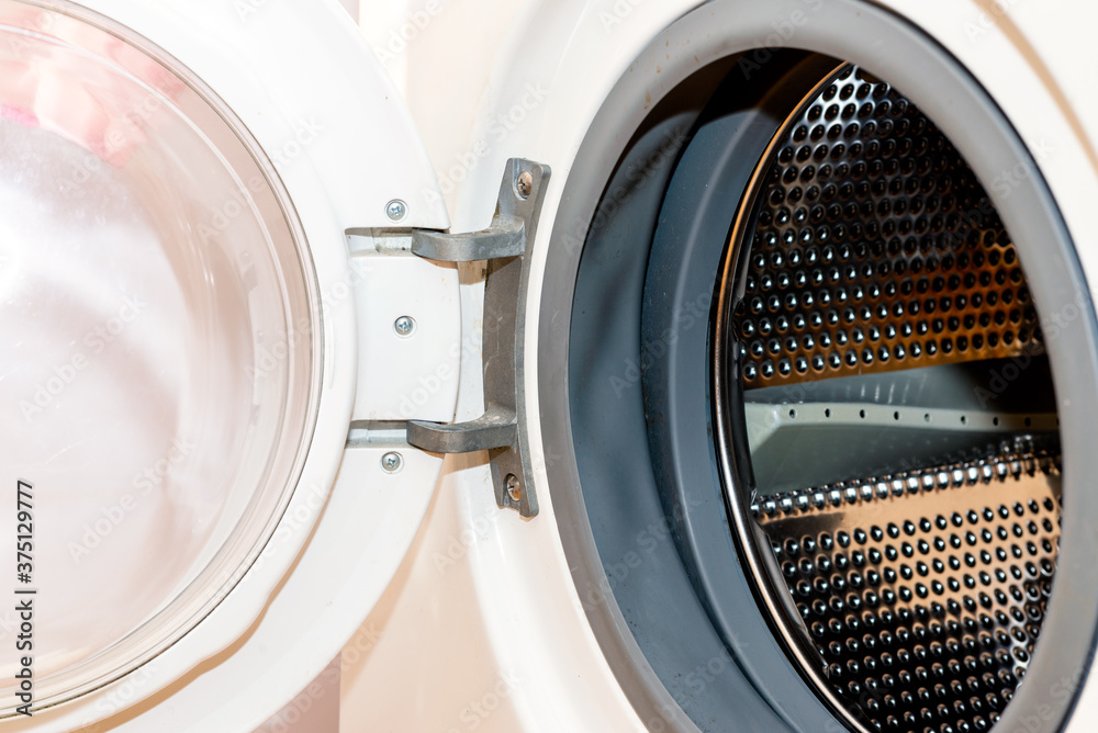 Old dirty washing machine close up, selective focus, door open Old dirty washing machine close up, selective focus, door open