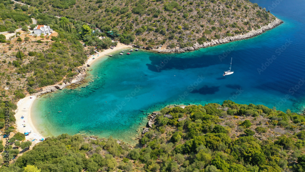 Aerial drone photo of turquoise heart shaped paradise sandy beach and bay of Sarakiniko a safe sail boat anchorage in Ithaki or Ithaca island, Ionian, Greece