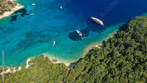 Fototapeta Naklejka Na Ścianę i Meble -  Aerial drone photo of turquoise paradise sandy beach and bay of Filatro a safe sail boat anchorage in Ithaki or Ithaca island, Ionian, Greece