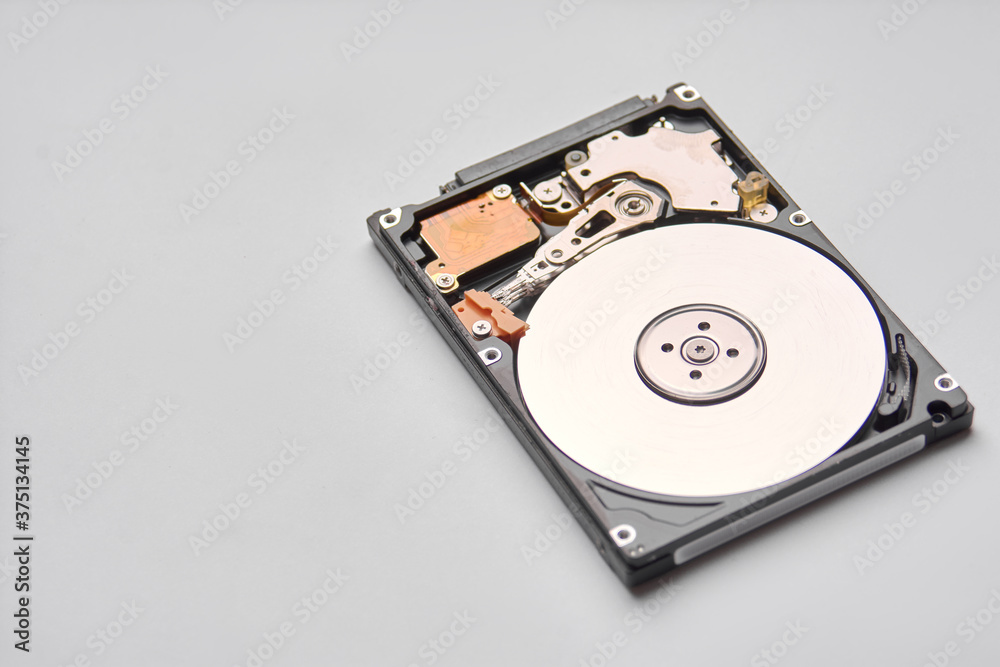 Hdd - hard disk drive. Hard disk repair concept, computer industry. Disassembled hard drive from the computer on white background Hdd - hard disk drive. Hard disk repair concept, computer industry. Disassembled hard drive from the computer on white background