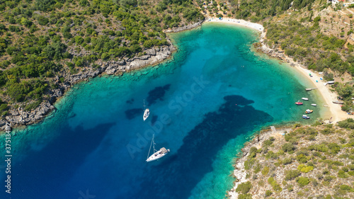 Aerial drone photo of turquoise paradise sandy beach and bay of Filatro a safe sail boat anchorage in Ithaki or Ithaca island, Ionian, Greece