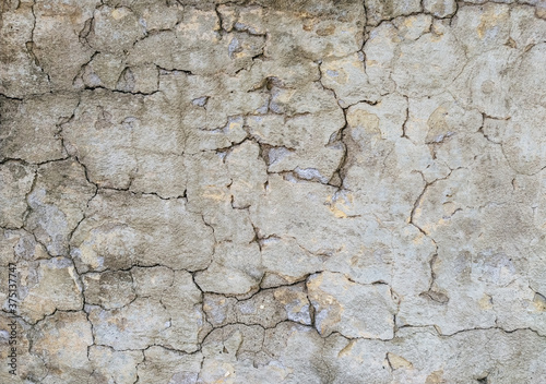 Texture of gray, dirty, cracked concrete wall. Cracks background.