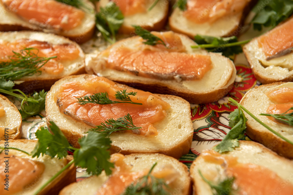 Sandwiches with salted salmon fish with greenery (selective focus) Sandwiches with salted salmon fish with greenery (selective focus)