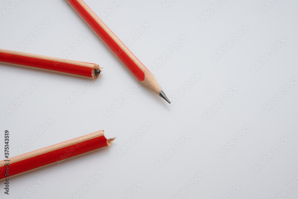A pencil broken in half and a pencil not broken
A pencil broken in half and a pencil not broken