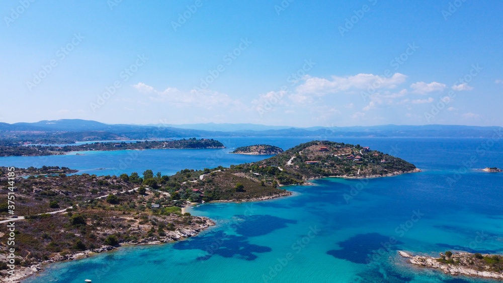 Aerial view of group of islands in blue sea 