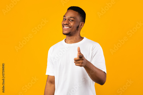 African Guy Pointing Fingers At Camera On Yellow Background, Studio