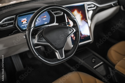 Modern suv car interior with leather seats and monitor screen © Moose