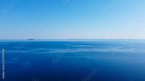 Open blue sea under blue sky.Aerial view  © Long Frame
