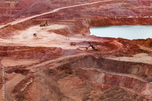 Photography Aluminium ore quarry and blue quarry lake in bauxite mine