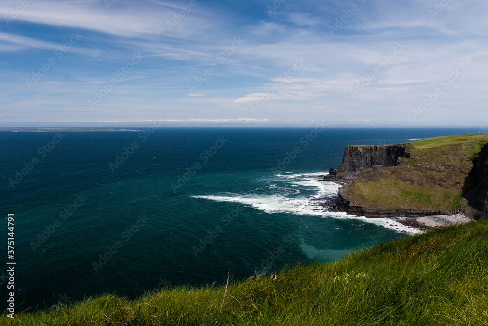 Photo capture of a breathtaking natural nature landscape. Cliffs of moher with Aran Islands view, wild atlantic way. Ireland. Europe