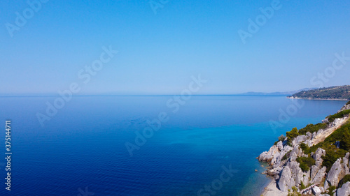 Fototapeta Naklejka Na Ścianę i Meble -  Aerial view of exotic blue clear sea and tropic coast