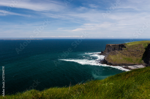 Photo capture of a breathtaking natural nature landscape. Cliffs of moher with Aran Islands view, wild atlantic way. Ireland. Europe