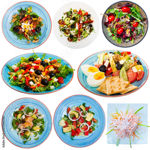 Set of various appetizing salads isolated on white background..