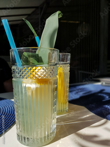 Delicious handmade lemonade on the table in small cafee with  bright lighting and interesting reflections photo