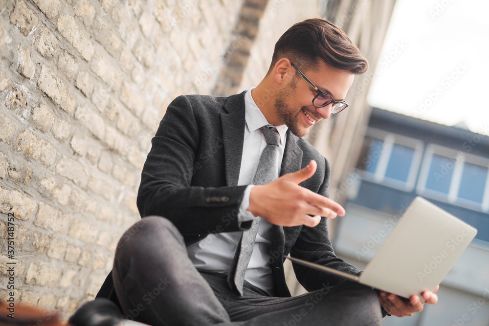 Businessman having video call on laptop Businessman having video call on laptop