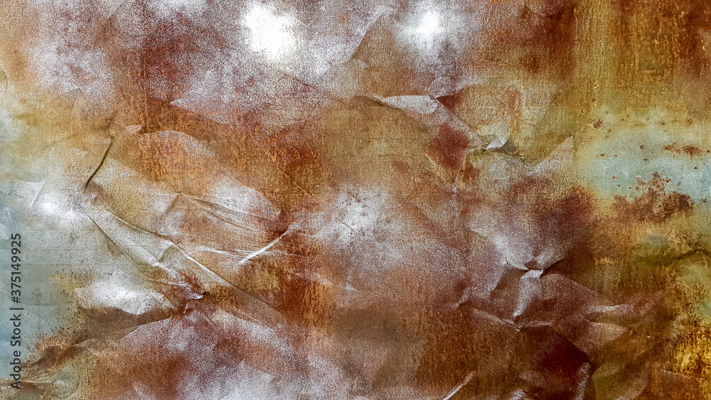 Seamless texture of old crumpled and rusty metal. A crumpled metal plate. Rusty grunge background of peeling paint. Close-up. For design, copy space