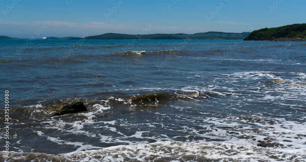 Waves at the seashore. Selective focus with shallow depth of field. Waves at the seashore. Selective focus with shallow depth of field.