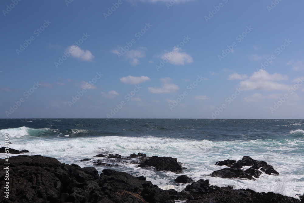 Rough waves and sky landscape of Udo Island in South Korea Rough waves and sky landscape of Udo Island in South Korea