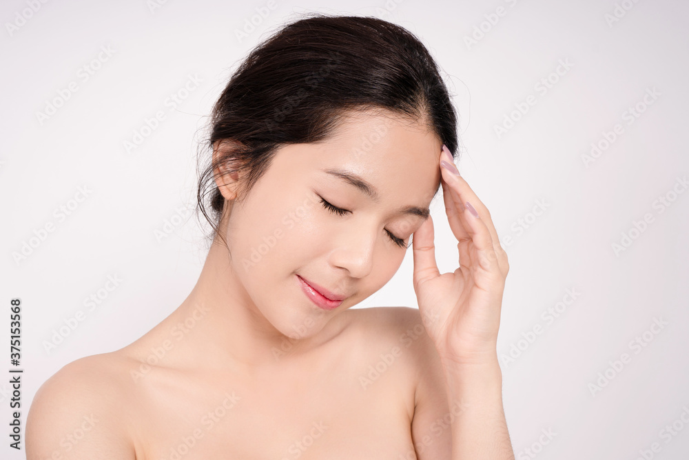 The face of Asian women has a clean, beautiful face. She touched her face with her hand. The face of Asian women has a clean, beautiful face. She touched her face with her hand.