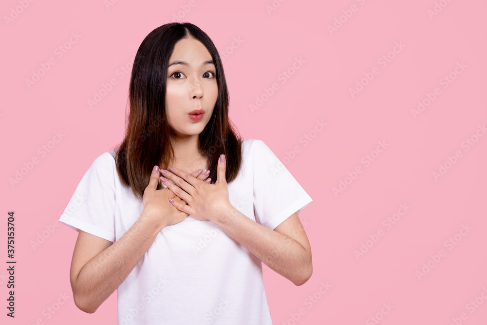 Asian women are very surprised. She showed signs of big eyes and touched her chest. Asian women are very surprised. She showed signs of big eyes and touched her chest.