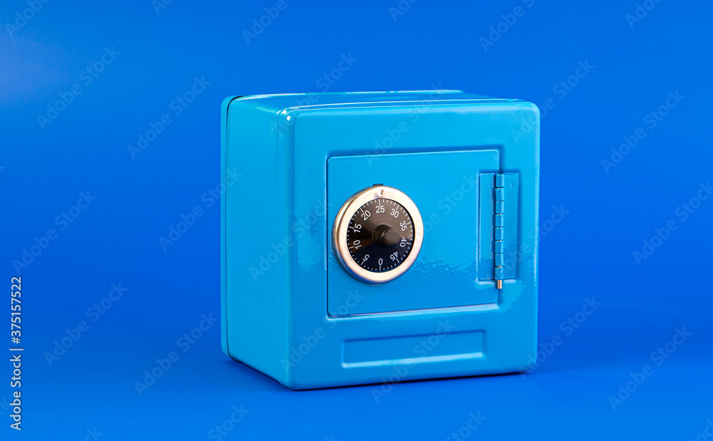 Blue moneybox (piggy bank) made as safe - obrazy, fototapety, plakaty 