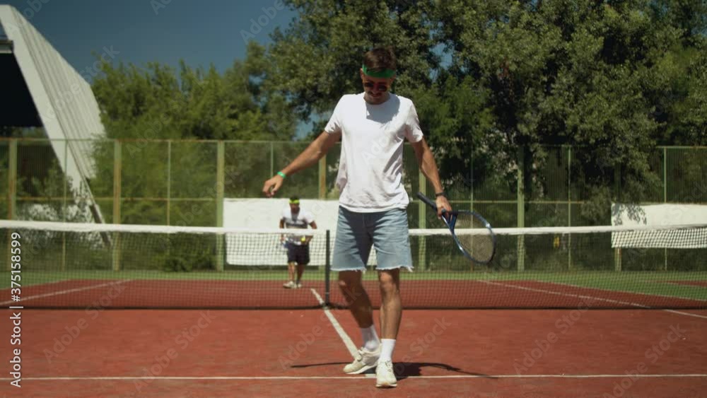 Tennis player warming up before match on court Tennis player warming up before match on court