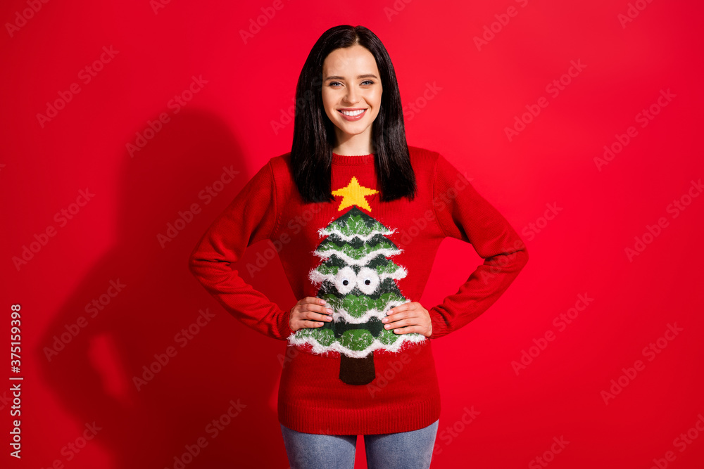 Portrait of her she nice-looking attractive pretty lovely cheerful cheery content girl hands on hips wearing ugly warm clothes isolated bright vivid shine vibrant red color background Portrait of her she nice-looking attractive pretty lovely cheerful cheery content girl hands on hips wearing ugly warm clothes isolated bright vivid shine vibrant red color background