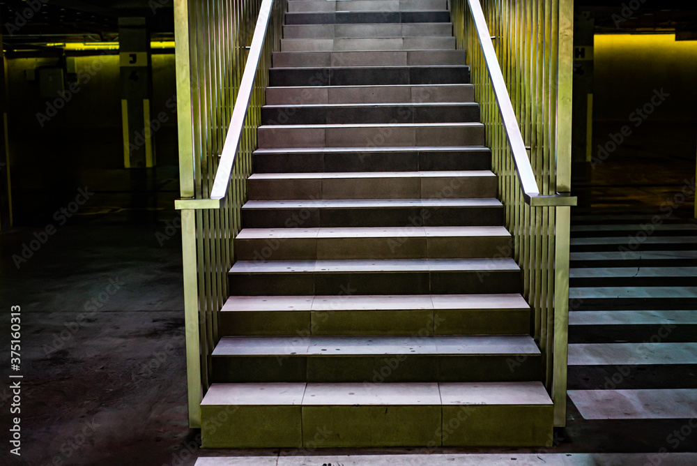 Modern concrete stairs with metal handrails Modern concrete stairs with metal handrails