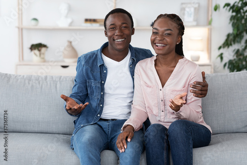 Found Compromise. Happy Black Couple Posing At Counselor's Office After Successful Therapy