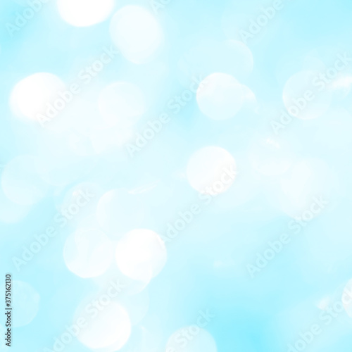 Bokeh light on blue background, sky with circle glitter light blue. Snow abstract soft glowing with vivid bright light and bokeh blur effect. 