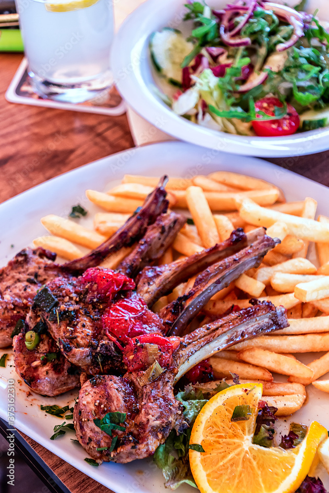 Grilled Lamb Chops with French fries and salad Grilled Lamb Chops with French fries and salad