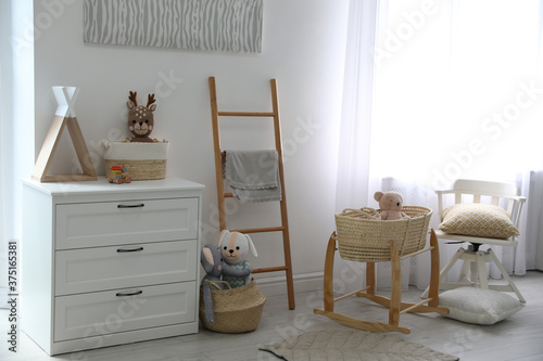 Cute children's room interior with wooden decorative ladder © New Africa