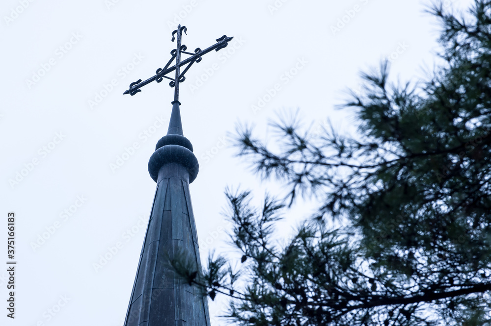 The catholic church building with cross.