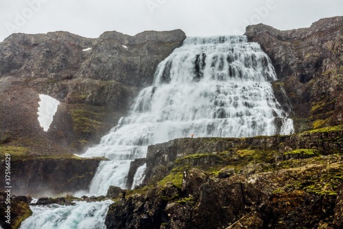 Waterfall in Iceland with rocky cliffs