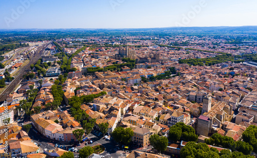 Picturesque aerial view of Narbonne cityscape overlooking ancient Gothic building of Cathedral of Saints Justus and Pastor, France photo