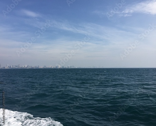 View of Pattaya city in Thailand Asia from a boat, looking at the sea and the skyline in the summer