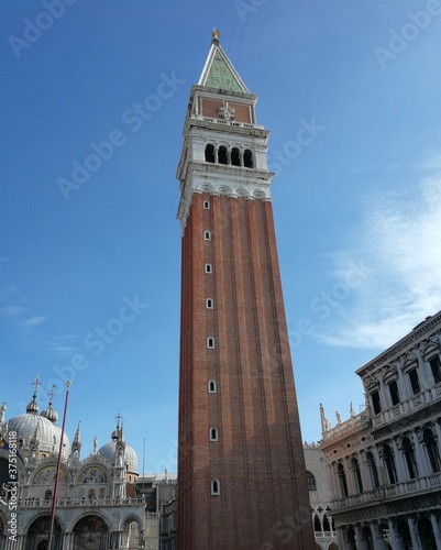 View of a tower in Venice square with a blue sky back drop. Venice Italy Europe  © adam